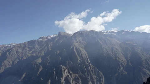 Snow-covered mountain range along deep Colca Canyon in the Andes mountains Stock Footage 135690725