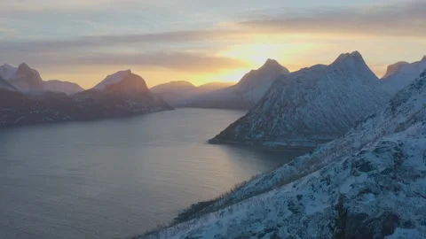 Snow covered mountain range on coastline in winter, Norway. Senja Stock Footage 234322965