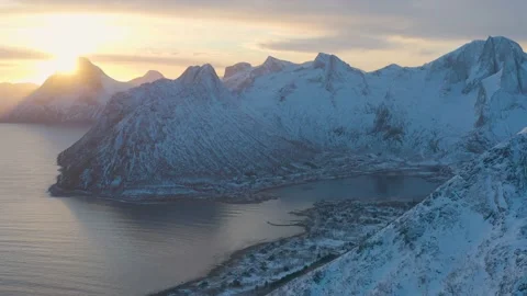 Snow covered mountain range on coastline in winter, Norway. Senja Stock Footage 234434926