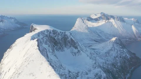 Snow covered mountain range on coastline in winter, Norway. Senja Stock-Footage 234441747