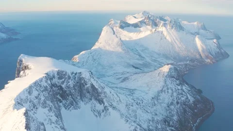 Snow covered mountain range on coastline in winter, Norway. Senjaard 스톡 동영상 234442941