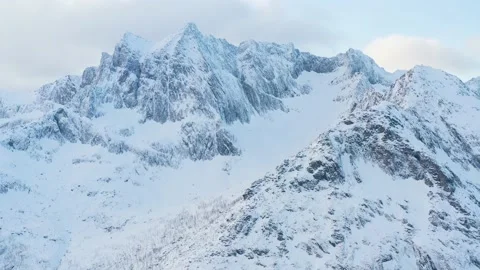 Snow covered mountain range on coastline in winter, Norway. Senja Stock-Footage 234548419