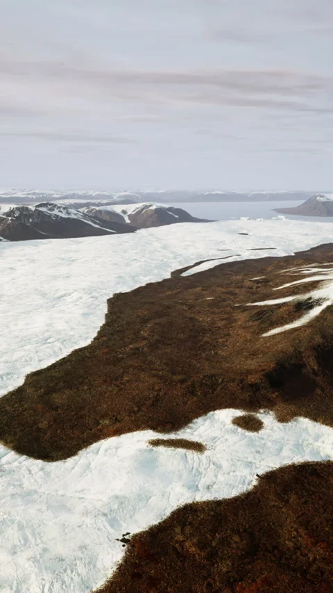 A snow-covered mountain range seen from above Vídeos de archivo 266221731