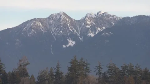 Snow-Covered Mountain Range in Soft Light Stock Footage 305957582