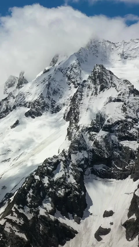 Snow-Covered Mountain Range with Stunning Winter Views Stock Footage 288014486
