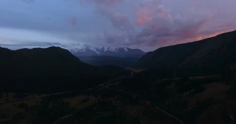 Snow-covered mountain range at sunset Stock Footage 80862805