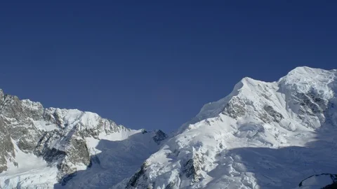 Snow covered mountain ranges during sunny day Stock Footage 116749298