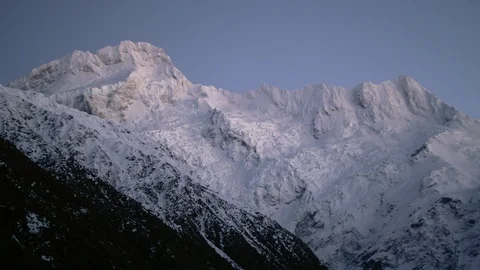 Snow covered mountain ranges at dusk Stock Footage 116749370