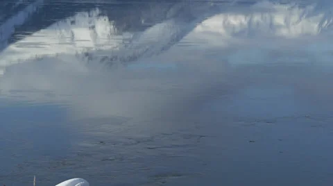 Snow Covered Mountain Reflected in Flowing Water Stock Footage 38060841