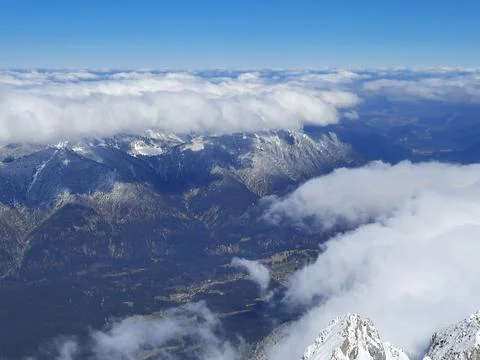 Snow covered mountain top in Austria. View of the Alps from the Zugspitze, the Stock Photos