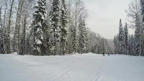 A snow-covered mountain winter forest with a ski lift at a ski resort. Stock-Footage 321564510