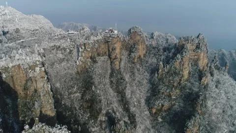 Snow covered mountains and cliffs create a winter wonderland landscape Stock-Footage 311819575
