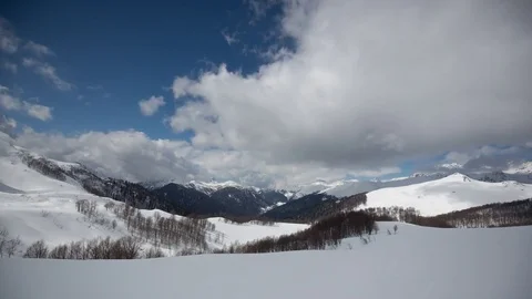 Snow-Covered Mountains And Clouds Timelapse Zoom in Stock-Footage 83694258