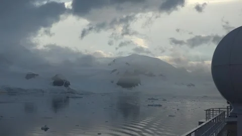 Snow-Covered Mountains and Floating Ice in the Western Antarctic Peninsula Stock Footage 344564491