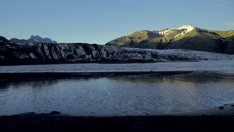 Snow covered mountains and glacier lagoon Stock Footage 73011053