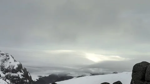 Snow-covered mountains in the blizzard Видео 45680488