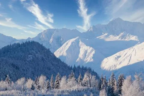 Snow covered mountains with clouds Stock Photos