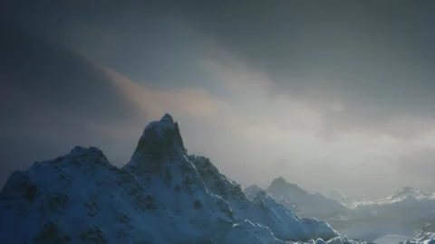 Snow covered mountains in a cloudy sky at dusk Stock Footage 345064412