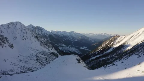 Snow-Covered Mountains With Deep Valleys Video stock 331695744