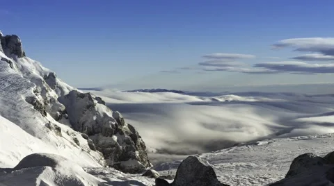 Snow-covered mountains with low clouds Stock Footage 45680267