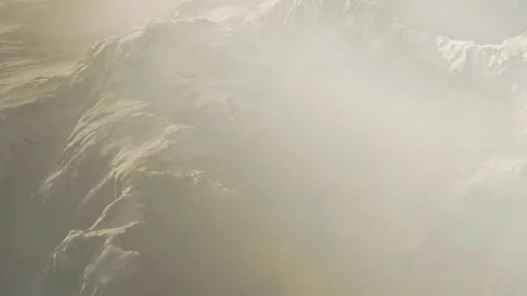 Snow covered mountains with mist in the background during winter season Stock Footage 345013351