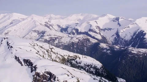 Snow-covered mountains showcase stunning winter landscape views Stock Footage 320304511