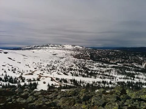 Snow covered mountains in the spring Stock Photos