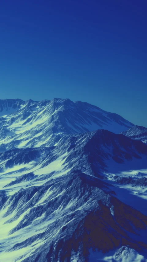 Snow covered mountains under clear blue sky during winter season 库存影片 334262377