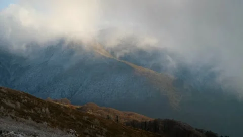 Snow-Covered Mountains Under Cloudy Sky Vídeos de archivo 293197914