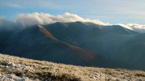 Snow-Covered Mountains Under Cloudy Sky Vídeos de archivo 293197947