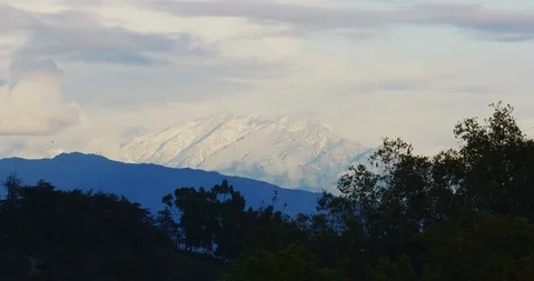 Snow covered mountains view from Griffith Park in Los Angeles, California Stock Footage 115808599