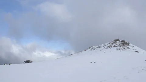 Snow covered mountains in winter, sun and clouds Stock Footage 128261128