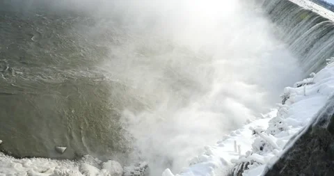Snow covered Niagara falls looking straight down torrent of water falling Stock Footage 229599001