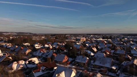 Snow-covered orange roofs of red brick houses on snowy winter day in Germany Stock-Footage 327480734