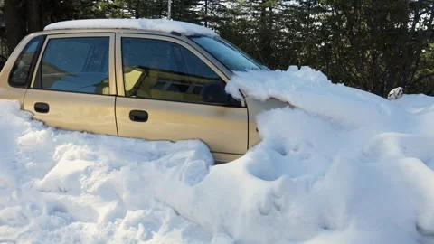 Snow covered parked car trapped during winter season outdoors Stock Footage 328706448