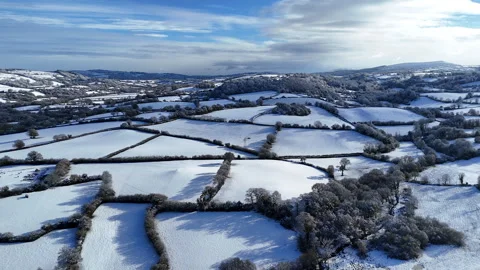 Snow Covered Patchwork Countryside Panorama Stock Footage 345960077