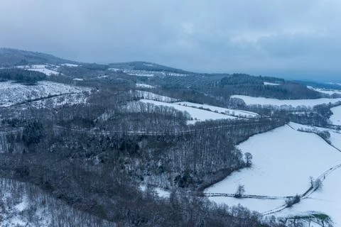 Snow-covered patchwork landscape in Morvan hills 库存照片