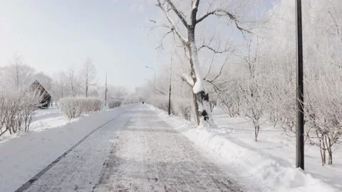 Snow-covered path in the city park Stock-Footage 232876236