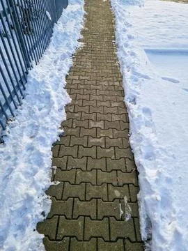 Snow-Covered Path Cleared for Walking Stock Photos