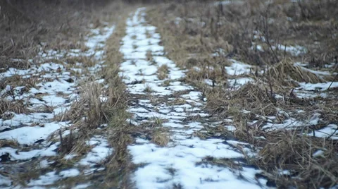 Snow-covered path in the grass Stock Footage 35422223