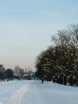 Snow covered path winding toward Wawel Cathedral in Krakow, Poland, features Stock Photos