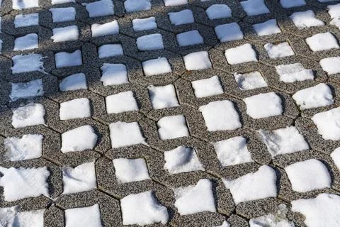 Snow Covered Pavement Pattern in Winter Light Stock Photos