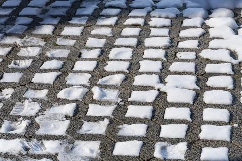 Snow Covered Pavement Pattern in Winter Light Stock Photos