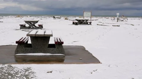 Snow-covered picnic table in a park. Stock Footage 220315482