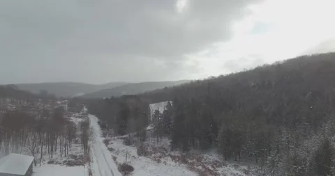 SNOW COVERED ROAD WITH CAR Video stock 146800153