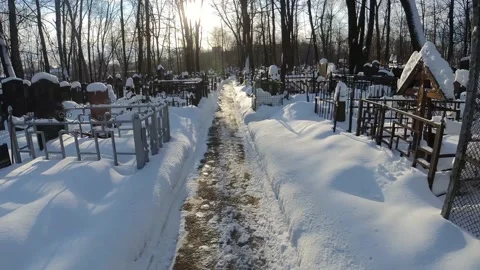 Snow-covered road to the cemetery Stock Footage 168548563