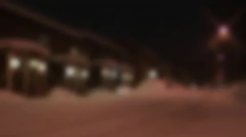 A snow covered road outside a house in the winter Stock Footage