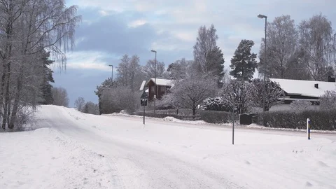 Snow covered road with passing car 스톡 동영상 102906355