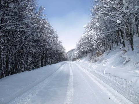Snow covered road Stock Photos