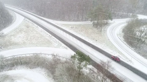 Snow-covered road through the forest Stock Footage 83402286